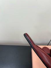 BOW MULES IN RED BROWN SHEEPSKIN