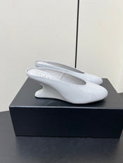 ALAIA WEDGE MULES 25S IN WHITE LAMBSKIN