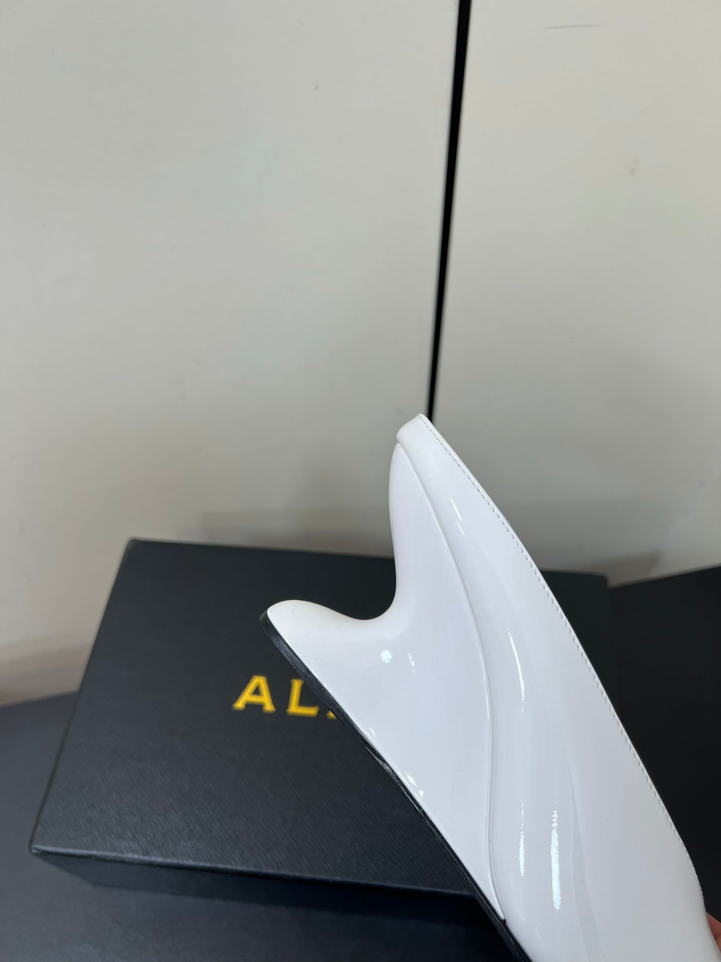 ALAIA WEDGE MULES 25S IN CREAM WHITE LAMBSKIN