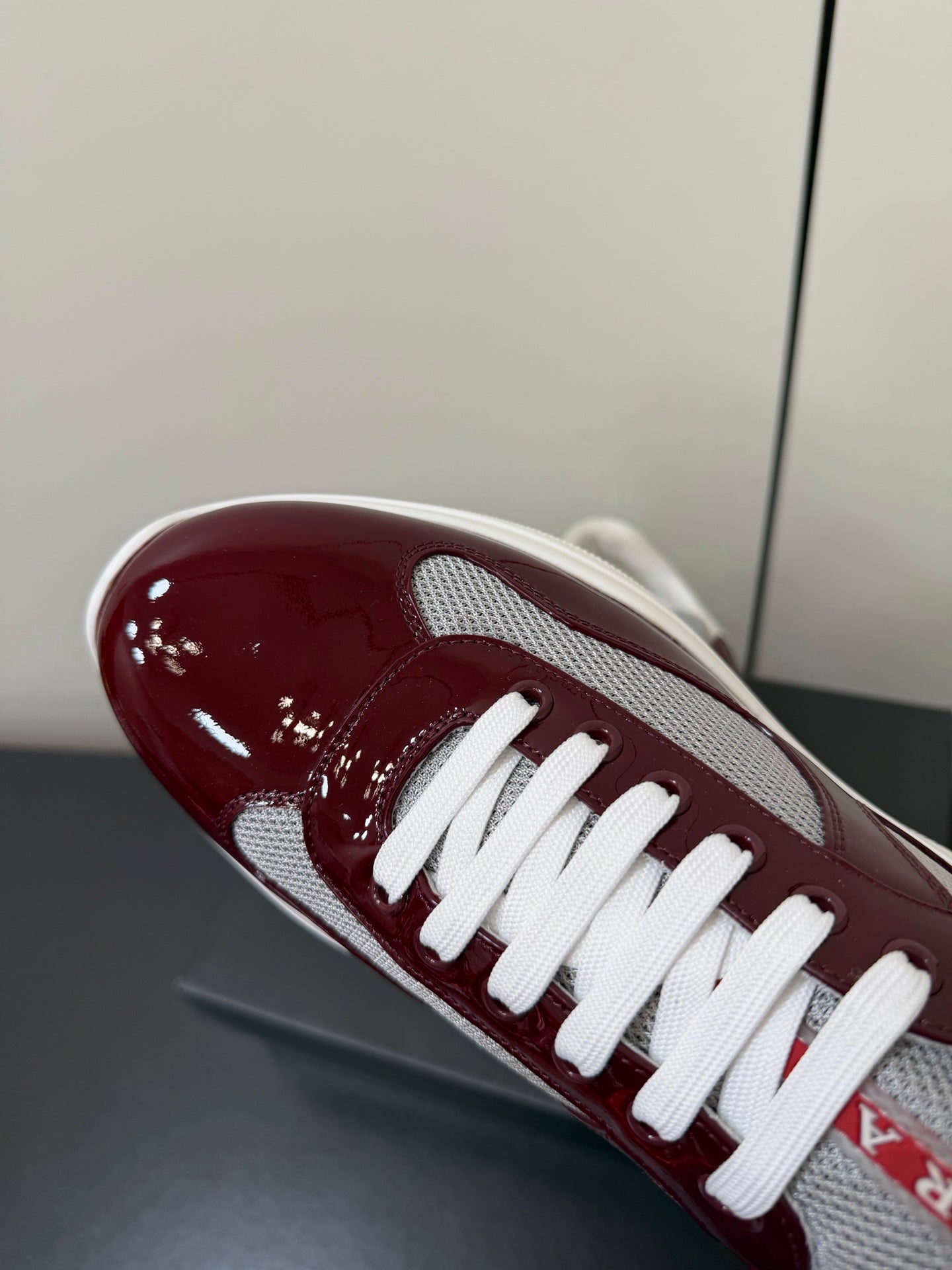 PRADA 26S SNEAKERS IN BURGUNDY RED PATENT CALFSKIN AND WHITE MESH