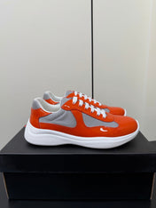 PRADA 26S SNEAKERS IN RED ORANGE PATENT CALFSKIN AND WHITE MESH