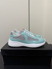 PRADA 26S SNEAKERS IN SOFT TEAL PATENT CALFSKIN AND WHITE MESH