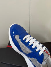 PRADA 26S SNEAKERS IN DARK BLUE PATENT CALFSKIN AND WHITE MESH