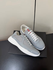 PRADA 26S SNEAKERS IN LIGHT GRAY PATENT CALFSKIN AND WHITE MESH