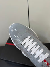 PRADA 26S SNEAKERS IN LIGHT GRAY PATENT CALFSKIN AND WHITE MESH