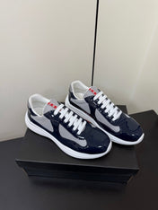 PRADA 26S SNEAKERS IN NAVY BLUE PATENT CALFSKIN AND WHITE MESH