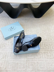 TRIANGLE LOGO SLINGBACK PUMPS WITH BOW IN BLACK CALFSKIN