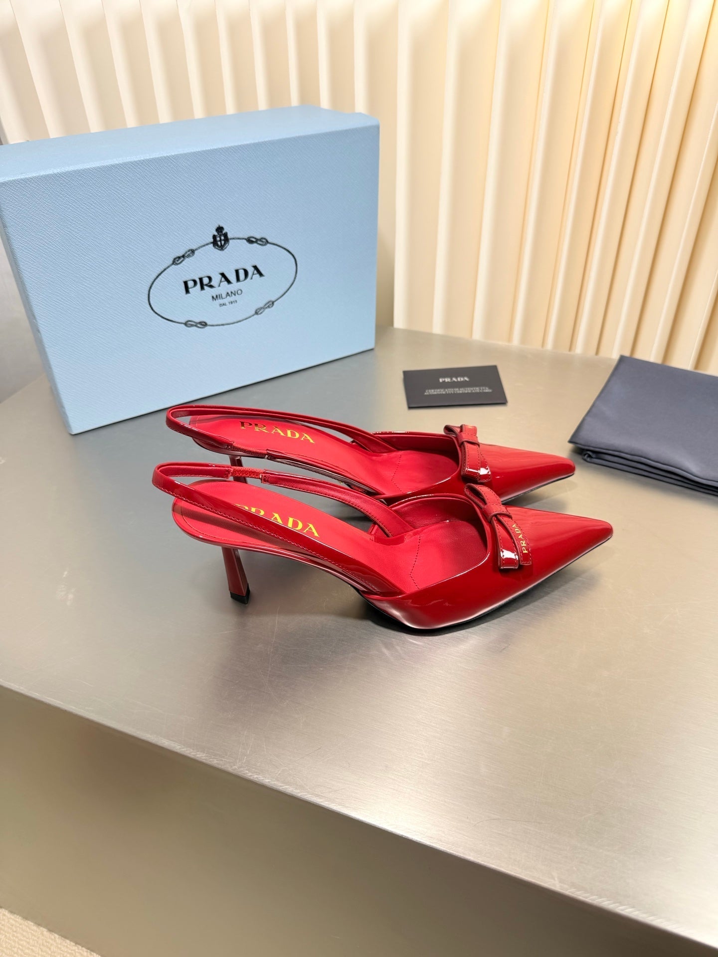 PRADA 26S POINTED-TOE SLINGBACK PUMPS IN RED PATENT CALFSKIN WITH BOW