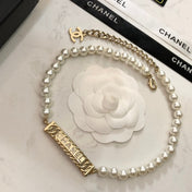 CHANEL 26S CHANEL LETTER CRYSTAL BAR PEARL NECKLACE IN GOLD METAL 631883