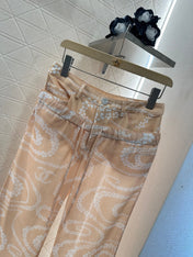 CHANEL BEIGE PRINTED DENIM PANTS