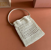 WANDER BUCKET BAG 23 WHITE IN RAFFIA WITH LEATHER TRIM