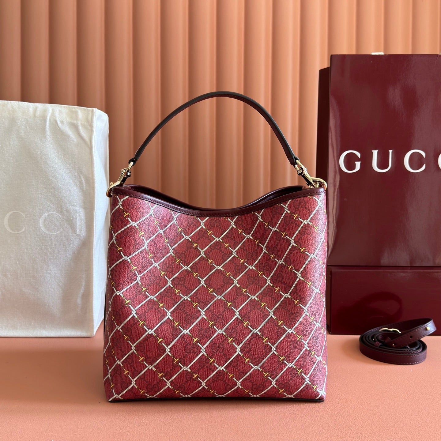 GUCCI 26S GG EMBLEM BUCKET BAG 25 IN DARK RED COATED FABRIC