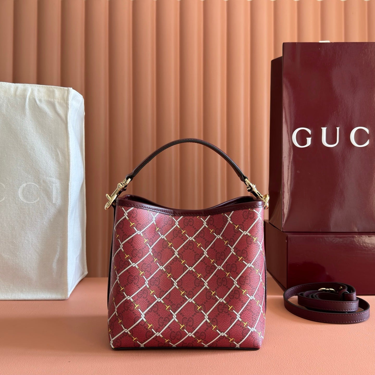 GUCCI 26S GG EMBLEM BUCKET BAG 19 IN DARK RED COATED FABRIC