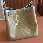 GUCCI 26S GG EMBLEM BUCKET BAG 19 IN BEIGE AND SILVER CANVAS