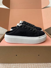 WASH SNEAKER MULES IN BLACK DENIM