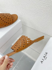 ALAIA VIENNE FLAT MULES IN CHOCOLATE BROWN LAMBSKIN