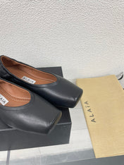 ALAIA BALLET FLATS IN BLACK CALFSKIN