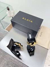 ALAIA 26S DOUBLE STRAP WEDGE SANDALS 110 MM IN BLACK GLOSSY CALFSKIN WITH GOLD HARDWARE