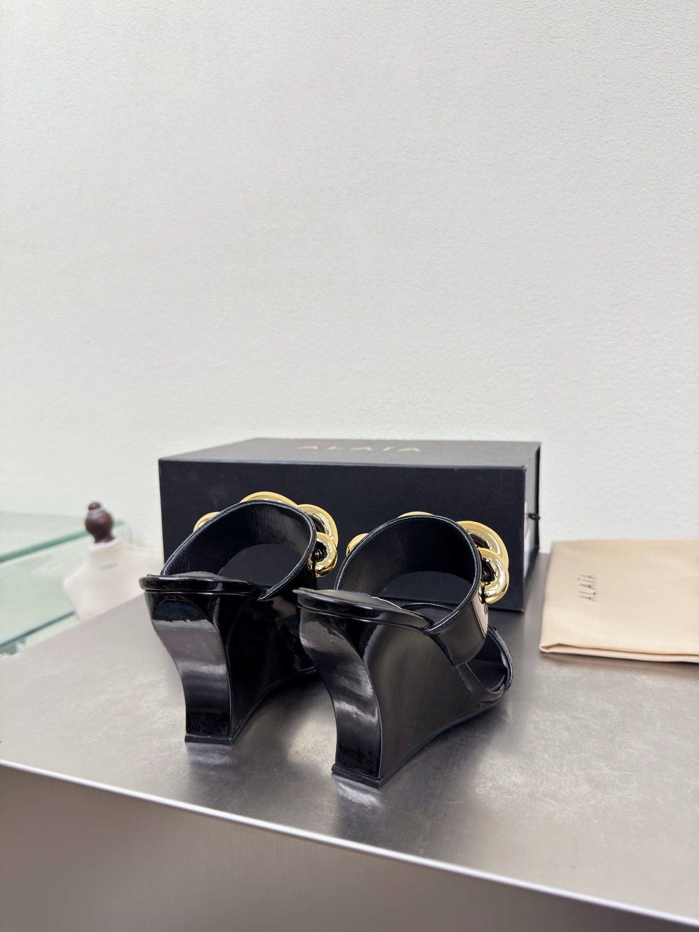 ALAIA 26S DOUBLE STRAP WEDGE SANDALS 110 MM IN BLACK GLOSSY CALFSKIN WITH GOLD HARDWARE