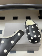 BALENCIAGA 25S FUR-LINED MULES IN BLACK AND WHITE FAUX LEATHER