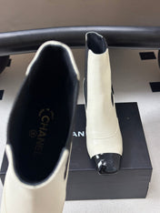 CHANEL 26S ANKLE BOOTS 60 MM IN WHITE CALFSKIN AND BLACK PATENT