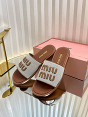 SLIDES SANDALS IN BROWN STRAW WOVEN
