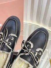 MIUMIU 26S FUR BOAT SHOES IN BLACK CALFSKIN