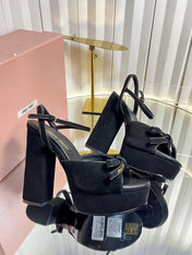 MIUMIU 26S PLATFORM ANKLE STRAP SANDALS 120MM IN BLACK SUEDE WITH BOW