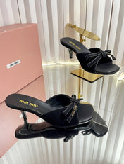 MIUMIU 26S MULE SANDALS 55MM IN BLACK SUEDE WITH BOW
