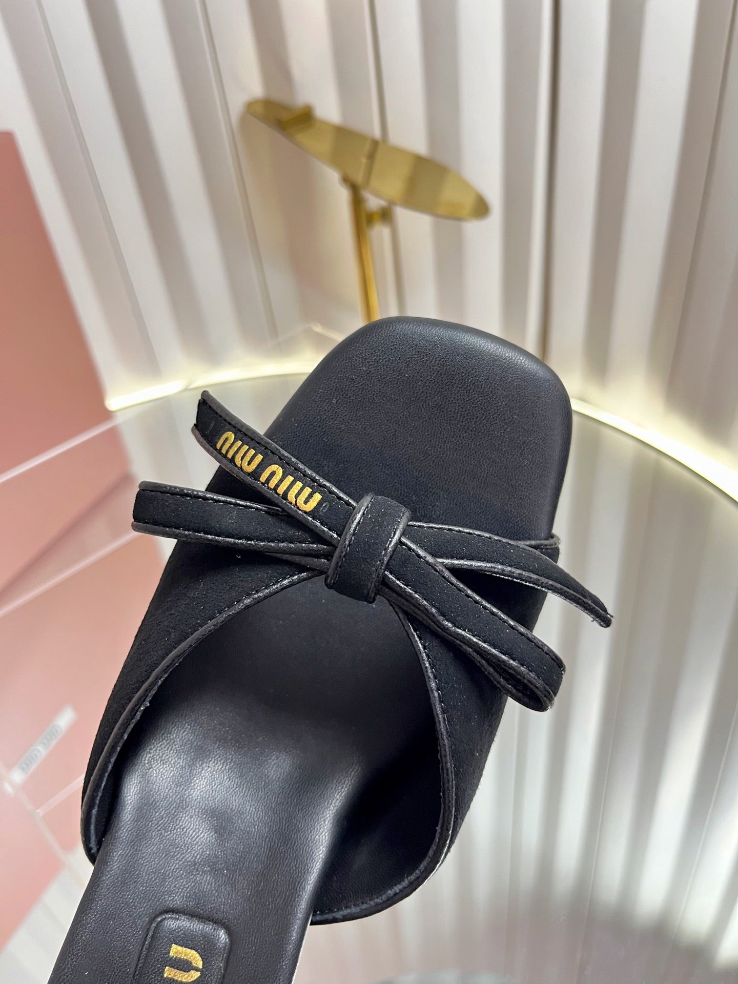 MIUMIU 26S MULE SANDALS 55MM IN BLACK SUEDE WITH BOW