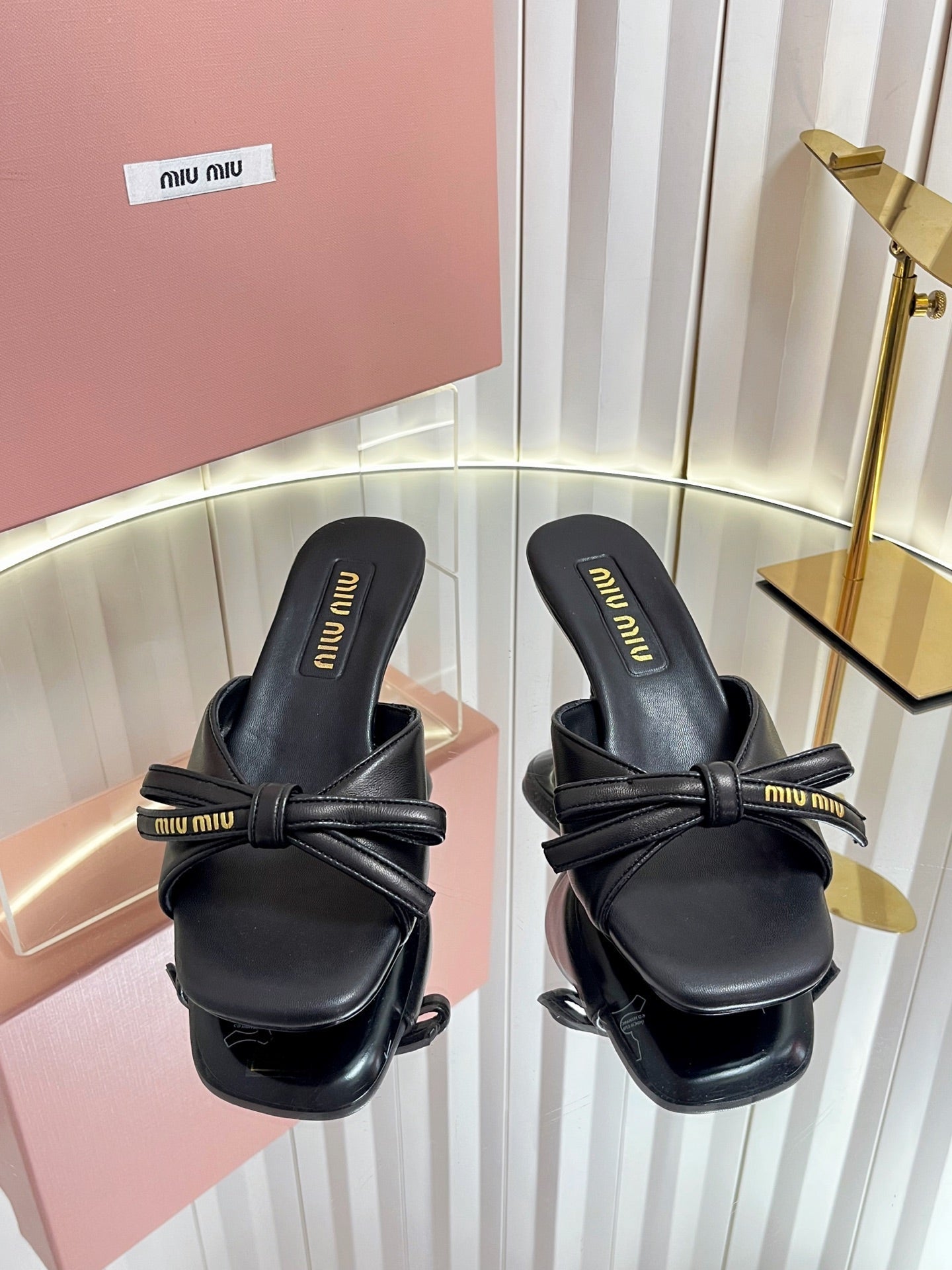 MIUMIU 26S MULE SANDALS 55MM IN BLACK CALFSKIN WITH BOW