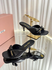 MIUMIU 26S MULE SANDALS 55MM IN BLACK CALFSKIN WITH BOW
