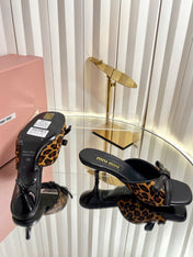 MIUMIU 26S MULE SANDALS 55MM IN LEOPARD PRINT CALF HAIR WITH BOW