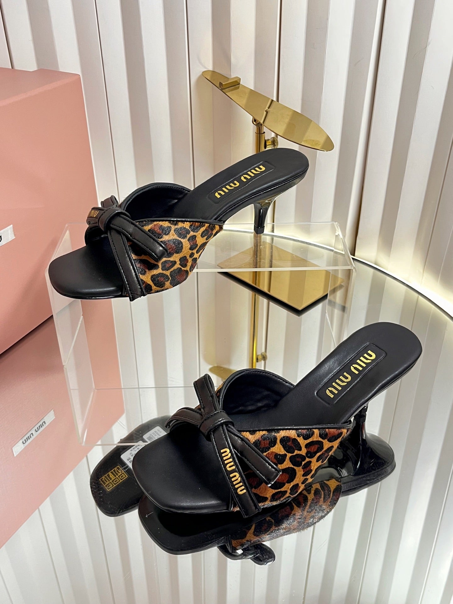 MIUMIU 26S MULE SANDALS 55MM IN LEOPARD PRINT CALF HAIR WITH BOW