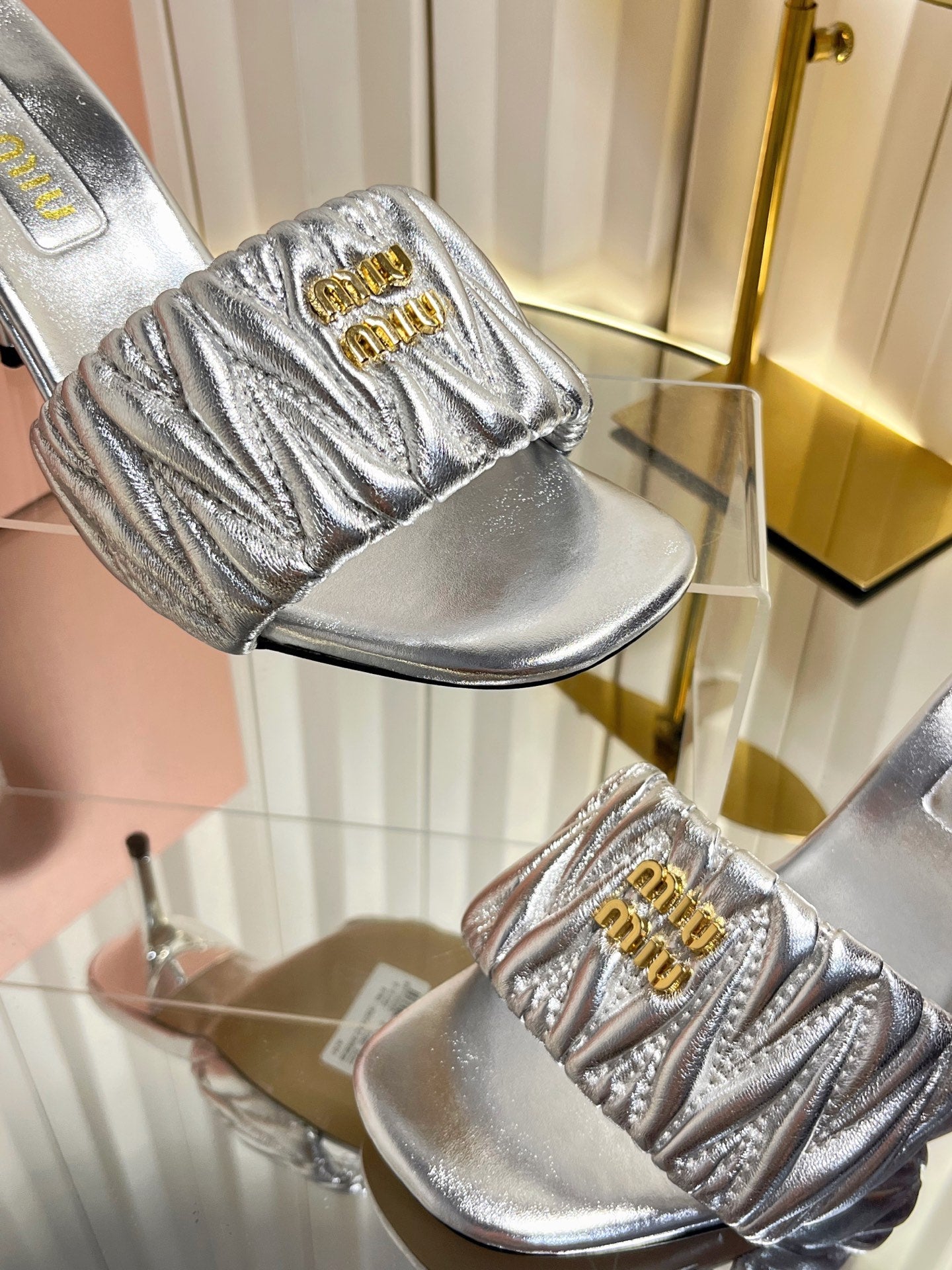 MIUMIU 26S HIGH-HEEL MULE SANDALS 85MM IN SILVER CALFSKIN GOLD HARDWARE