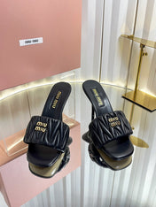 MIUMIU 26S HIGH-HEEL MULE SANDALS 85MM IN BLACK CALFSKIN GOLD HARDWARE