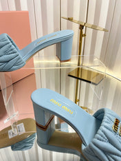 MIUMIU 26S PADDED MATELASSE MULE HEELS 65MM IN LIGHT BLUE CALFSKIN GOLD HARDWARE