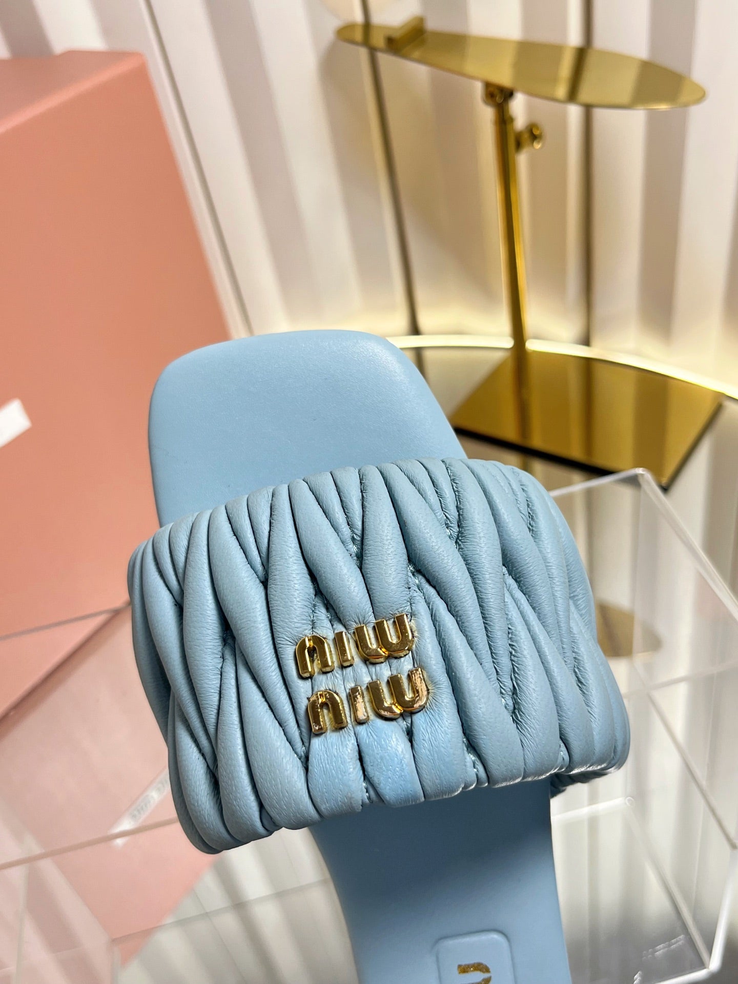 MIUMIU 26S MATELASSE SLIDES IN LIGHT BLUE CALFSKIN GOLD HARDWARE