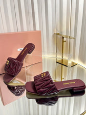 MIUMIU 26S MATELASSE SLIDES IN BURGUNDY RED CALFSKIN GOLD HARDWARE