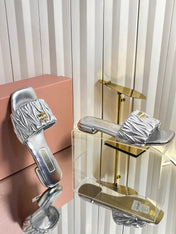 MIUMIU 26S MATELASSE SLIDES IN SILVER CALFSKIN GOLD HARDWARE