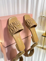 MIUMIU 26S MATELASSE SLIDES IN TAN BROWN CALFSKIN GOLD HARDWARE