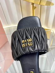 MIUMIU 26S MATELASSE SLIDES IN BLACK CALFSKIN GOLD HARDWARE
