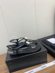 CC THONG SANDAL IN BLACK LAMBSKIN WITH PEARL FLOWER