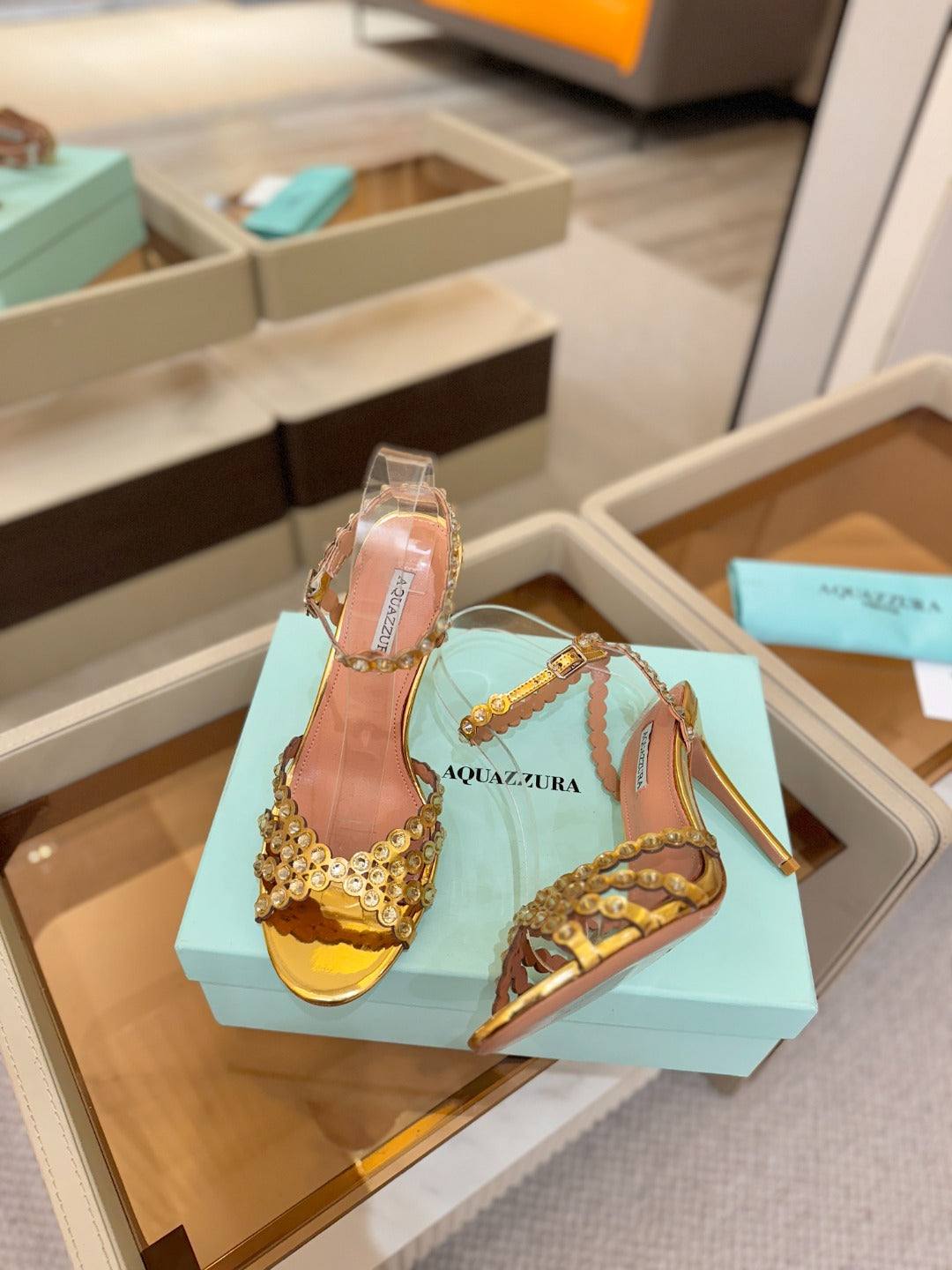 AQUAZZURA 26S STRAPPY HIGH HEELS 105 MM IN GOLD PATENT LAMBSKIN