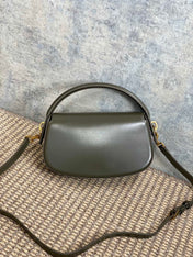 VOLTAIRE HALF-MOON SHOULDER BAG 24 IN DARK GREEN CALFSKIN GOLD METALLIC