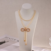 CD 26S PEARL BOW DROP STATEMENT NECKLACE IN GOLD TONE METAL 629848