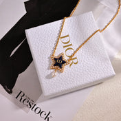 CD 26S PEARL STAR LOGO PENDANT NECKLACE IN GOLD TONE METAL
