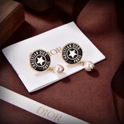 CD 26S STAR LOGO PEARL DROP EARRINGS IN GOLD TONE METAL 629949
