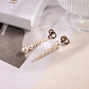 CD 26S PAVE LOGO PEARL DROP EARRINGS IN GOLD TONE METAL 631791