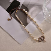 CD 26S PEARL STRAND CD CRYSTAL LOGO DROP NECKLACE IN GOLD TONE METAL 631858